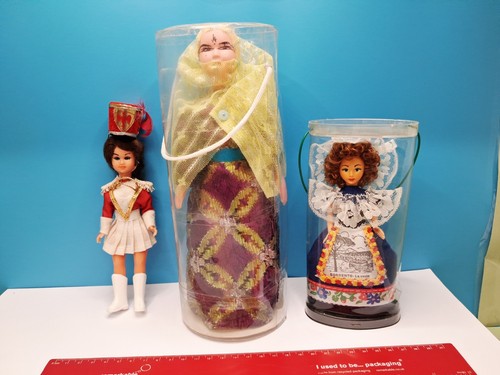 Three vintage souvenir dolls