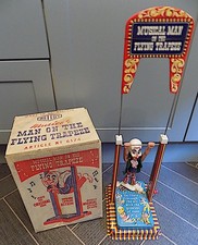 Vintage Tin & Plastic Crank Action Musical Man on the Flying Trapeze, Mettoy. GB