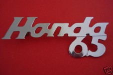 EMBLEM FRONT COVER LEGSHIELD LEG SHIELD C65 65CC 65