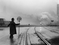 Man Holding Stop Sign At