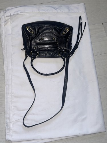 Black leather bag with gold