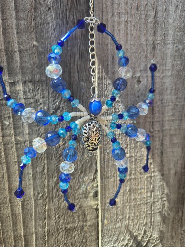 Blue beaded spider sun - beaded,