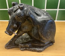 Tribal African soapstone statue of a reclining warthog scratching its Ear