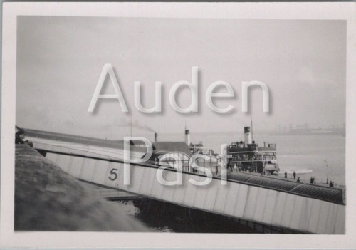 Pier with paddle steamer and - with,