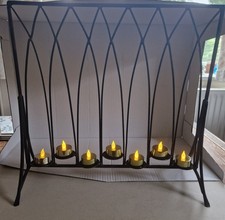 Metal Tea Light Candle Holder.  Used. Good Condition. Holds 7 Tealights. 