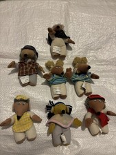 7  Wombles plush toys, which