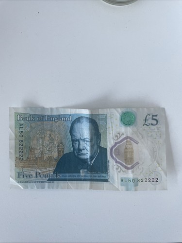 Pound note with - (five),