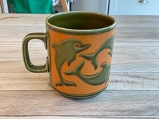 1973 Hornsea Pottery Olive-Green/Orange Colourway Dolphins Mug by John Clappison