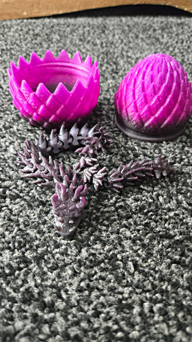 Purple dragon opening egg - dragon,