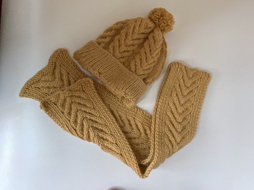 Hand knitted woollen hat and - hand,
