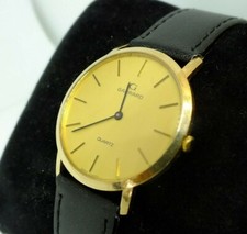 Garrard 9ct gold quartz watch - garrard,
