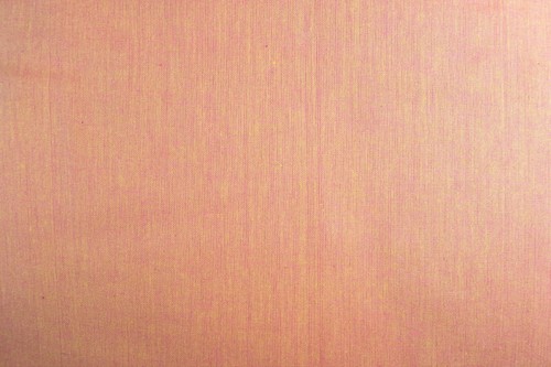 Peach peppered cotton fabric