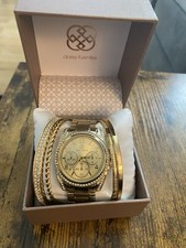 Daisy Fuentes Gold Watch and 4