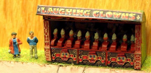 Funfair laughing clowns side - laughing,