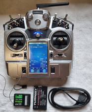 Turnigy I - 10 transmitter with charge lead and spare battery.