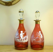 A Pair of Cranberry Mary Gregory Style Decanters