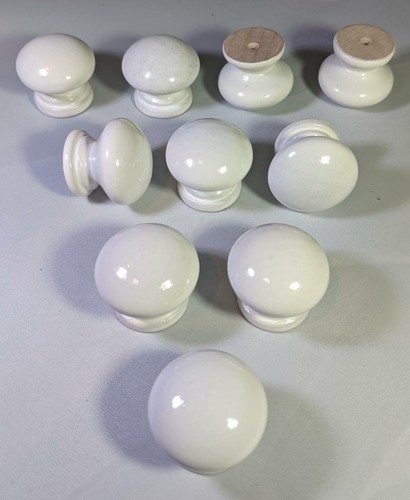 White wooden door knobs - door,