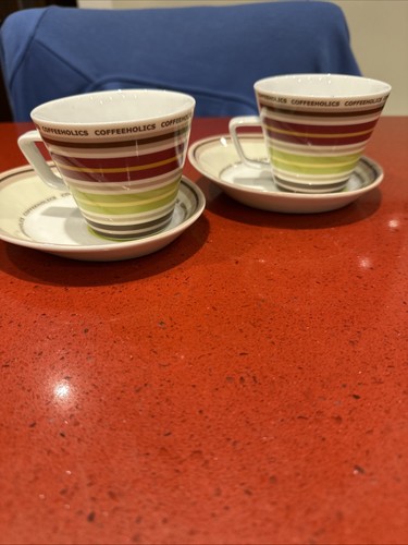 Coffeeholics cups and saucers - and,