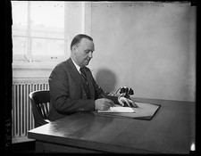 Photo:Man at Desk Writing