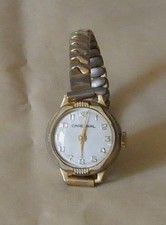 Vintage gold tone metal Cardinal ladies watch with expanding bracelet