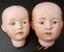 Two antique bisque doll - two,