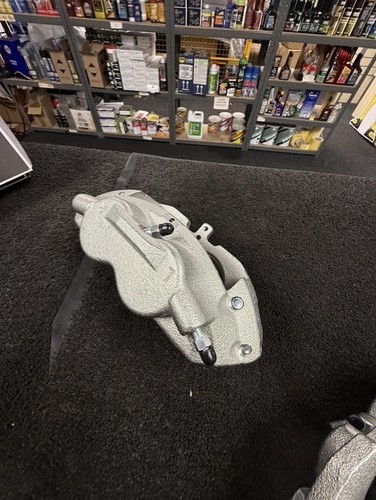 Front brake caliper - ,