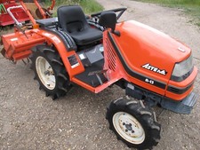 Kubota 4WD compact tractor with tiller rotavator.