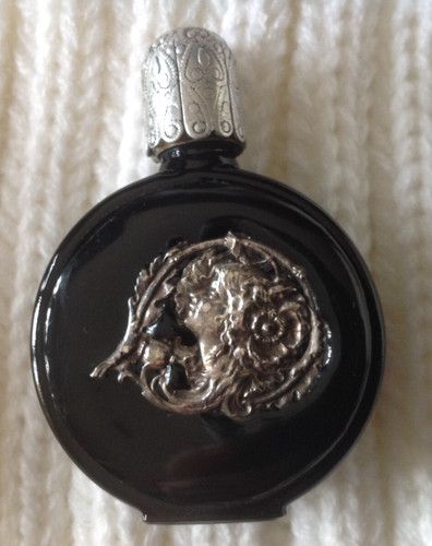 Miniature black perfume bottle