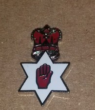red hand in star crown enamel