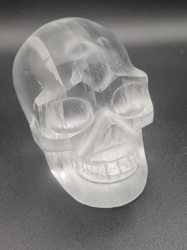 Large selenite skull hand - selenite,