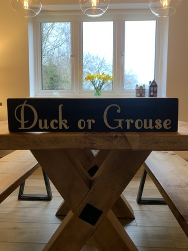 Duck grouse sign - or,
