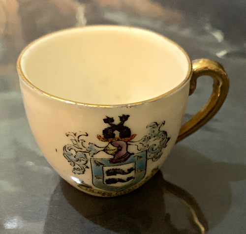 White ceramic cup gold handle - ceramic,