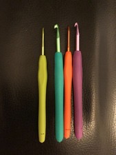 Set of four coloured ergonomic crochet hooks mixed sizes metal 14 cms