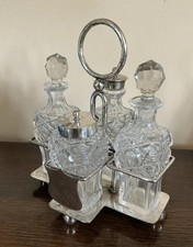An Antique Four Piece Cut Glass & Silver Plated Cruet Set by John Round c.1910