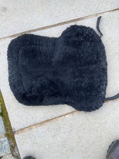 A Black Fleece Numnah Type Pad.   