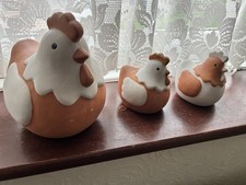 Set Of Three Chicken Ornaments In Ceramic Finish.