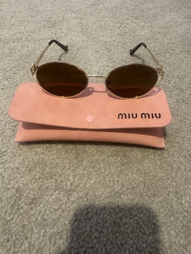Gold sunglasses miu - miu,