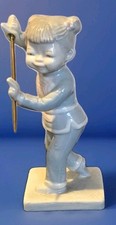 Lladro Style East Asian Female in Martial Arts Stance holding a Bo Staff 