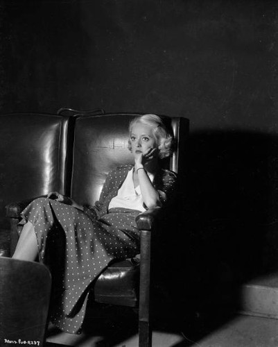 Bette davis sitting dejectedly - bette,