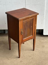 An Edwardian mahogany and boxwood lined bedside cabinet
