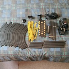 Hornby Hobbies  1:64  Micro Scalextric Track Bundle With PSU And Throttles. VGC.