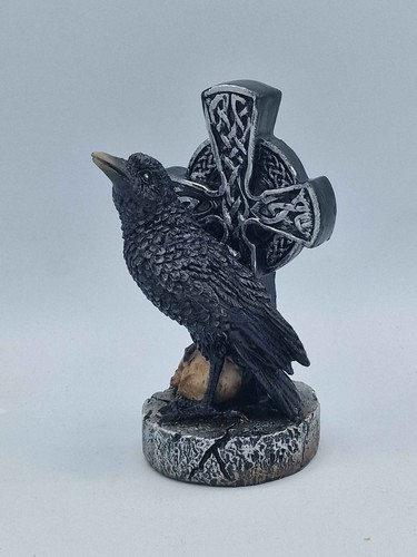 Raven figure front of - (b),