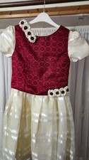 Girls Ivory dress, with burgurdy jacket.