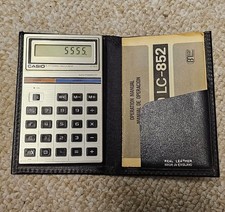Casio LC-852 calculator in wallet with SKOL larger logos Vintage