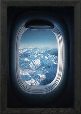 Airplane Window View of Snowy