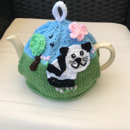 Hand knitted cat the - hand,