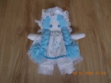Handcrafted rag doll in mop