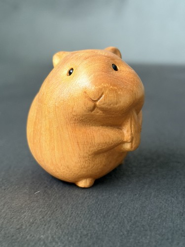 Hand carved cute guinea pig - hand,