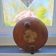 Antique fishing reel made from