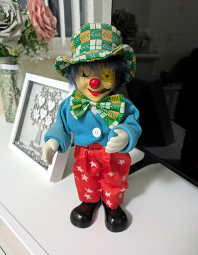 Porcelain clown doll moves - doll,